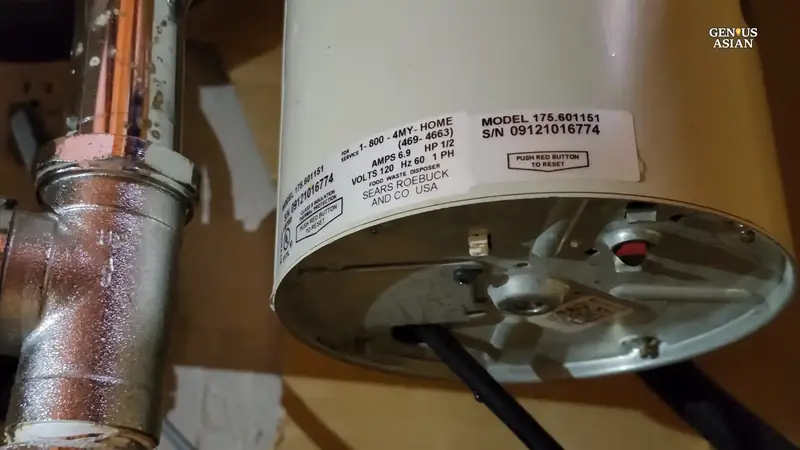 Garbage disposal leak repair under kitchen sink in Beaverton Oregon home